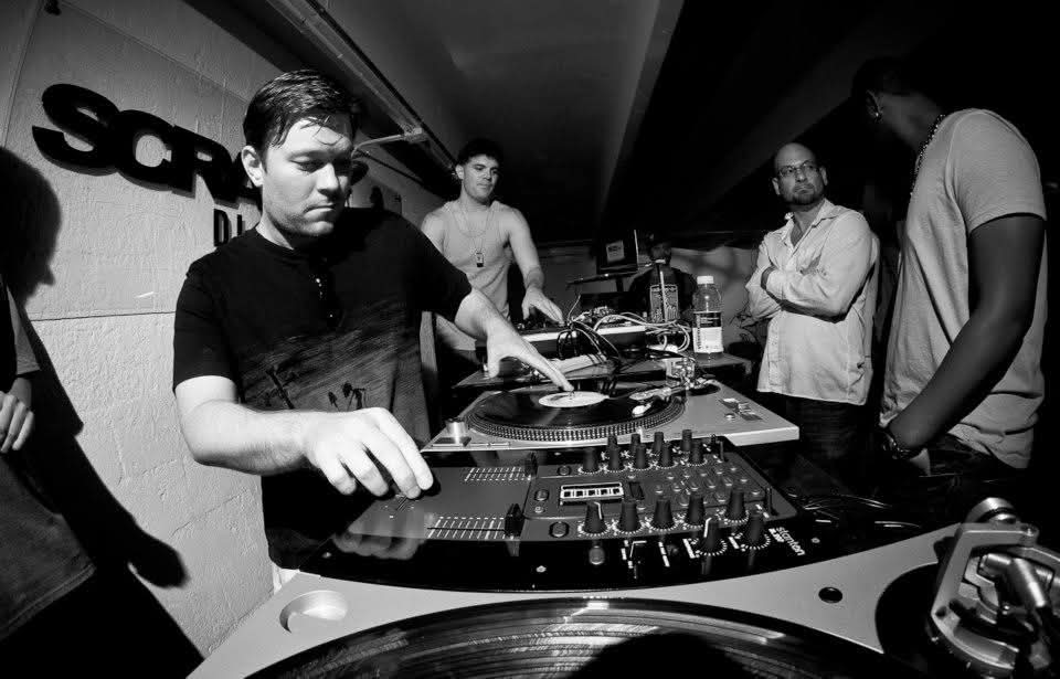 Close-up of DJ Real scratching on turntables