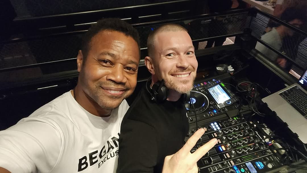 DJ Real on stage with crowd